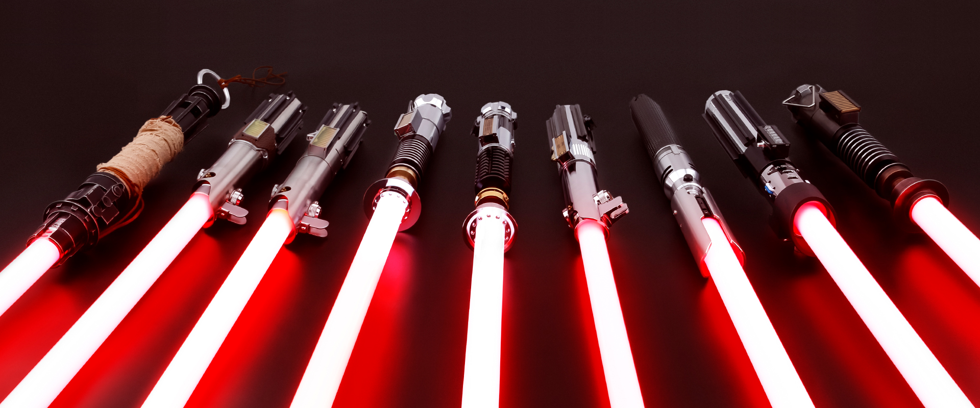 A picture of Multiple Lightsabers that all have red blades.